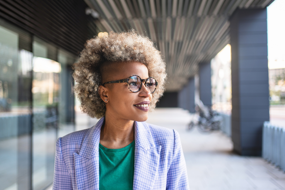 Smartly dressed woman looking confident and hopeful