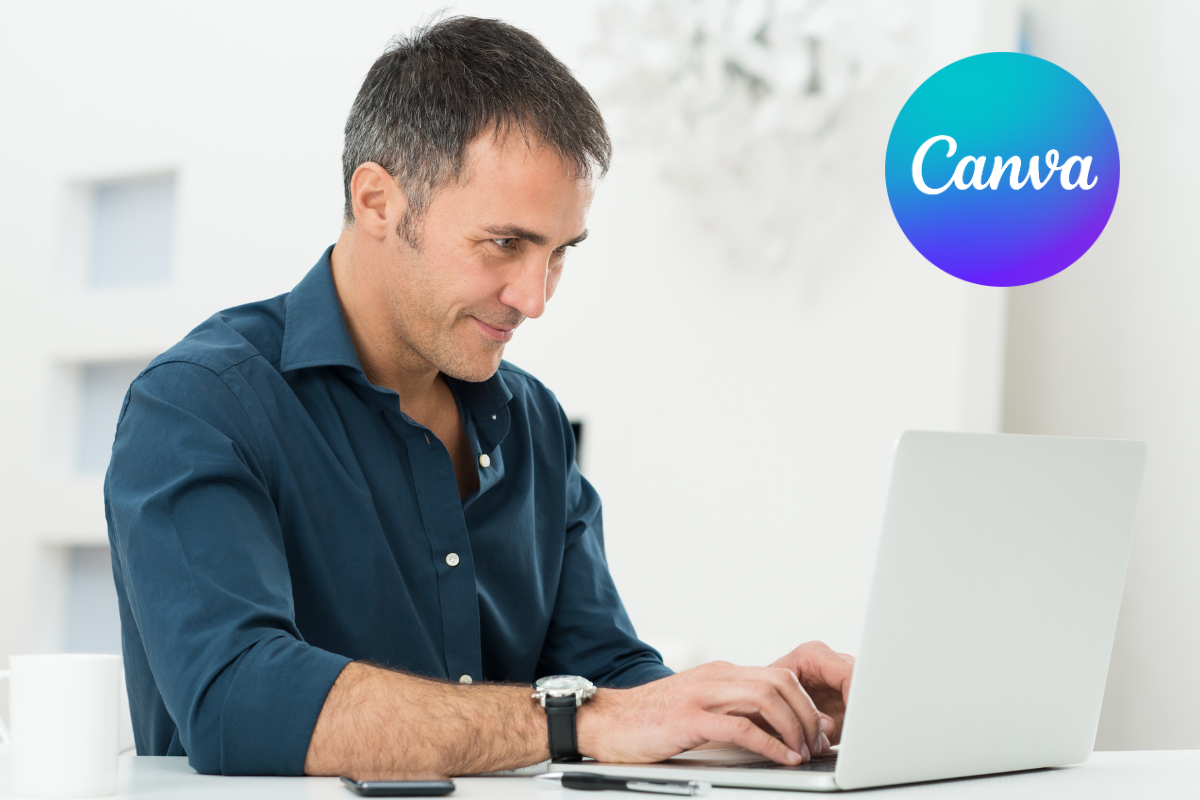A smiling man working on his laptop, enjoying the benefits of the Introduction to Canva course. The Canva logo is displayed in the top right-hand corner.